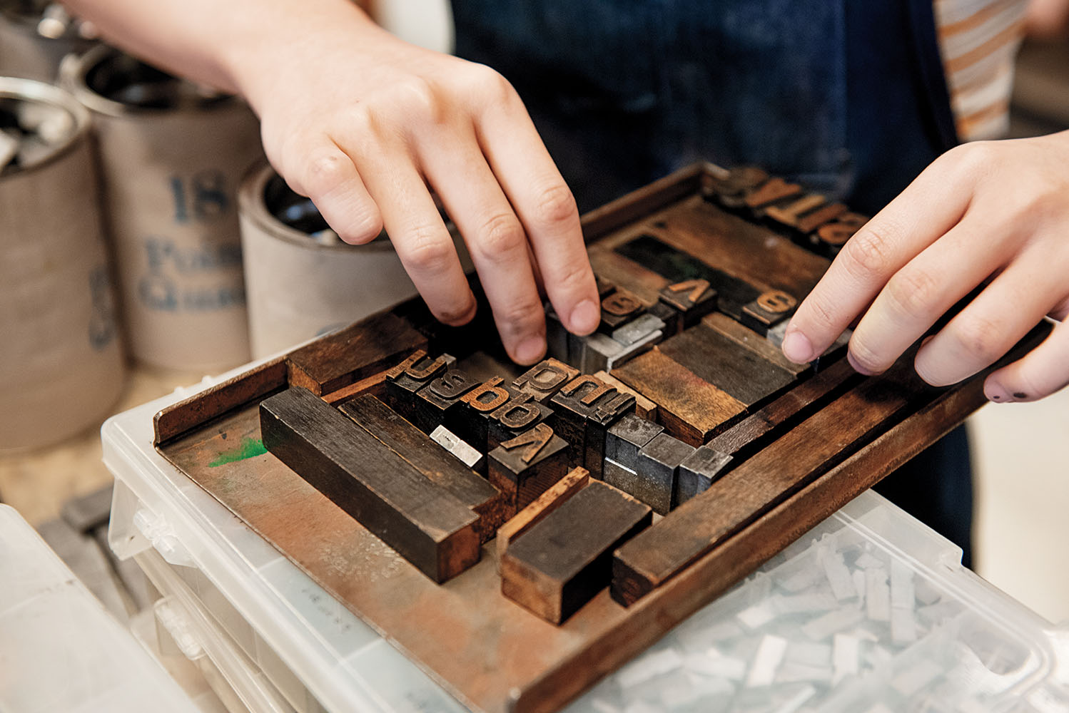 A student sets type in the Book Arts Lab, which celebrates its 75th anniversary this year.