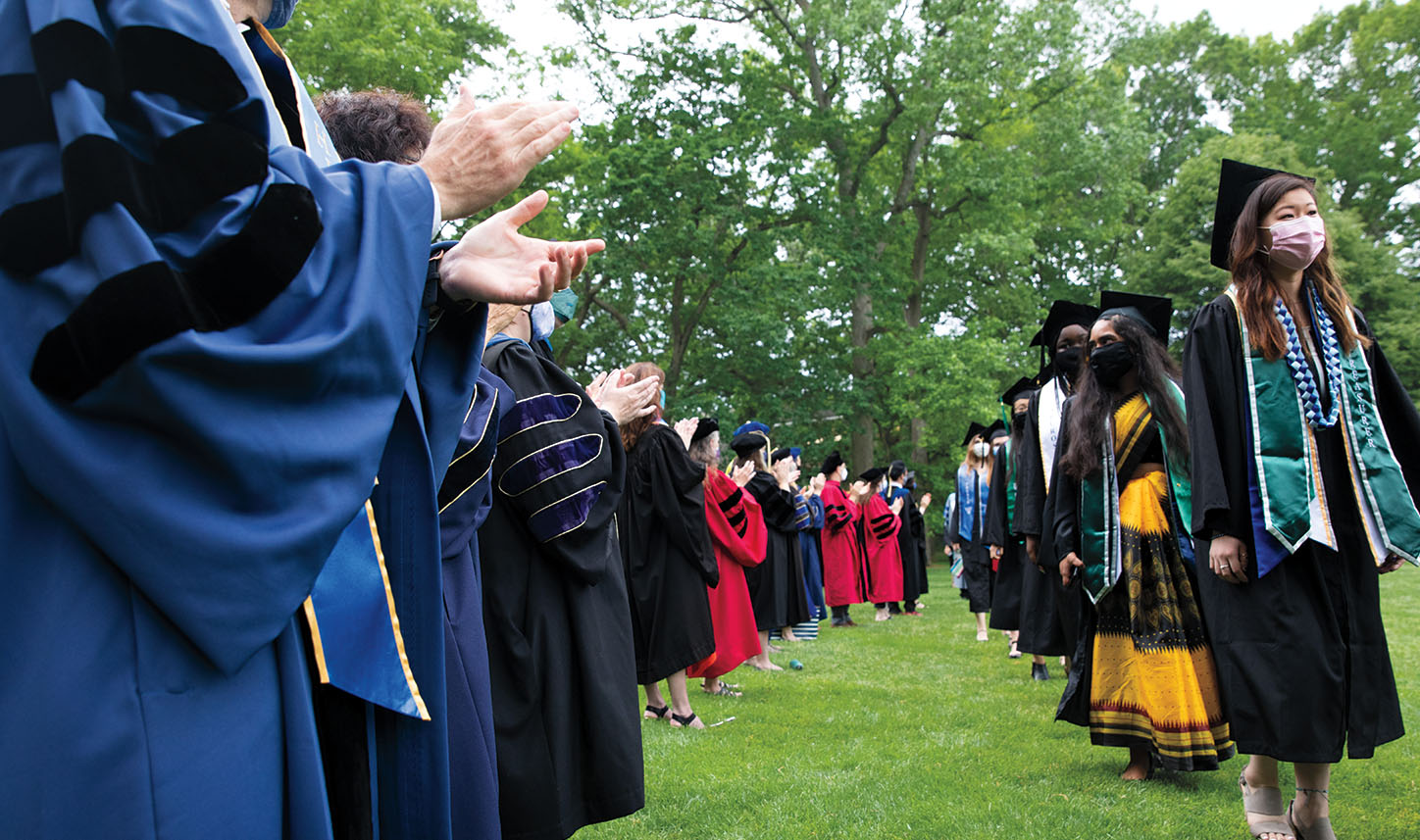 Wearing masks, the seniors process on Severence Green.