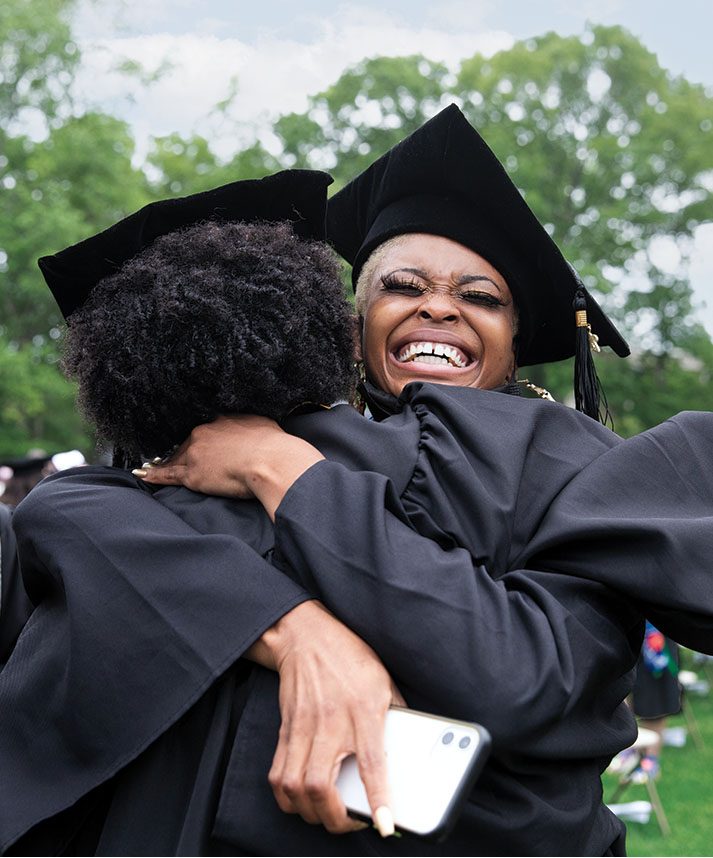 Asha Colbert ’21 and Shanez’e Johnson ’21 hug after commencement.