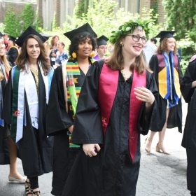 This photo shows a group of students lining up to process into Commencement.