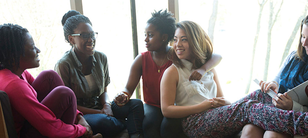 Friends hang out in Anderson Forum a gathering spot on capus