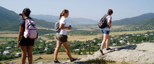 students hiking to dig site
